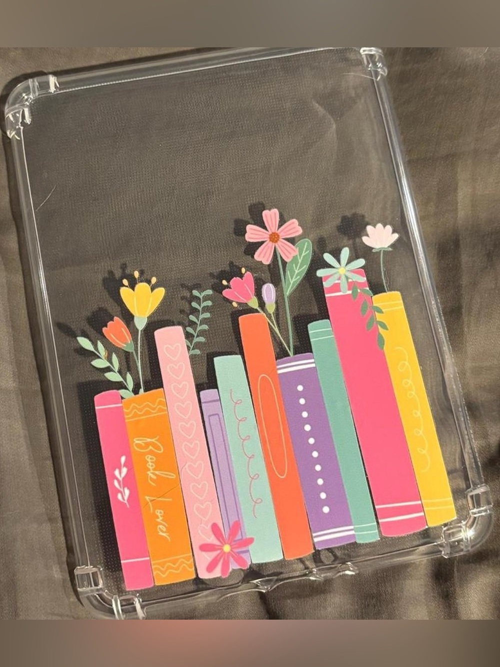 Clear Book-Themed Tablet Case with Colorful Floral Books